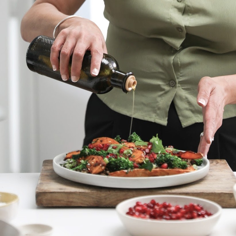 Adding extra virgin olive oil to Food